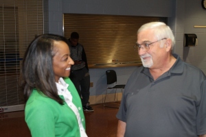Asst. Supt. Student Affairs Monica Spence chats with Board Member Mike Turay after Tuesday's board meeting. 